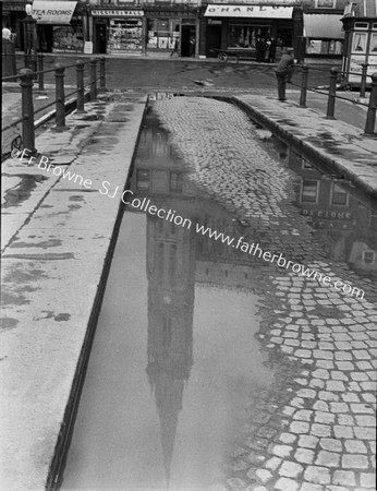 THE CATHEDRAL REFLECTED IN PUDDLE